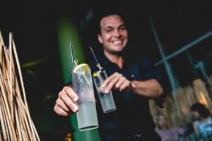 Amuse Bar's Bartender presenting 2 cocktails