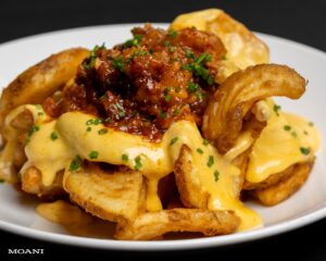 Crispy Potato Fries topped with cheese sauce and bacon truffle